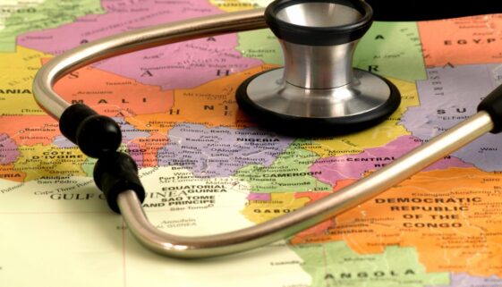 Concept - health care in Africa - map and stethoscope